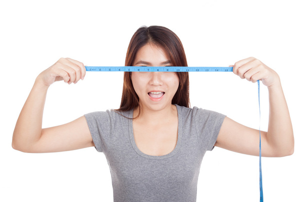 Young Asian woman with  measuring tape - Foto, imagen
