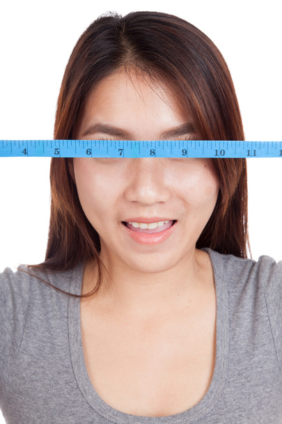 Young Asian woman with  measuring tape - Foto, Imagen
