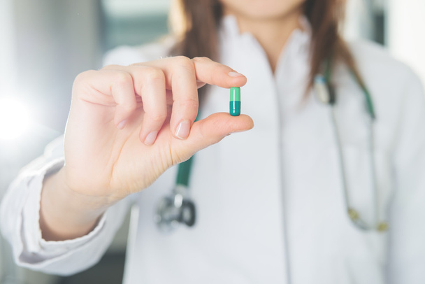 doctor hold a pill - Fotó, kép