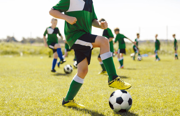 Outdoor Physical Education for Children. Football Education for Kids. Young Coach With Kids in Soccer Team on Training Unit. Youth Team Coach Training School Boys in Football Soccer - Foto, Imagen