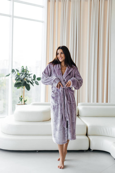 Young healthy serene woman girl relaxing in bathrobe and spa towel after having bath shower at home. Beauty treatment, rest and body care procedures. High quality photo - Fotografie, Obrázek
