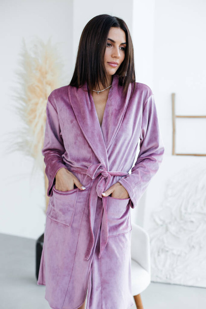 Young healthy serene woman girl relaxing in bathrobe and spa towel after having bath shower at home. Beauty treatment, rest and body care procedures. High quality photo - Foto, afbeelding