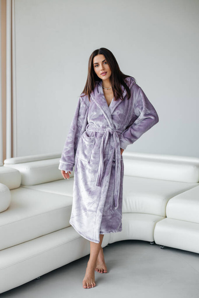 Young healthy serene woman girl relaxing in bathrobe and spa towel after having bath shower at home. Beauty treatment, rest and body care procedures. High quality photo - Φωτογραφία, εικόνα