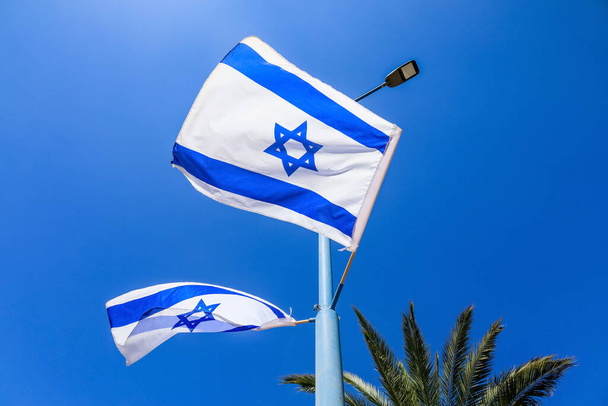Waving flags of Israel on sky background - Photo, image