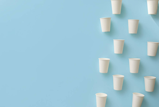 Paper cups on blue background - Photo, Image