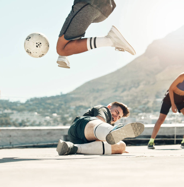 Ball, soccer and rooftop game with men sports training activity together fitness workout in city. Diversity, football competition and friends lifestyle exercise for health and wellness outdoors. - Photo, Image