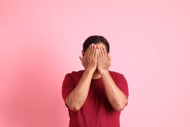 The 40s adult overweight Asian man standing on the pink background. - Photo, Image