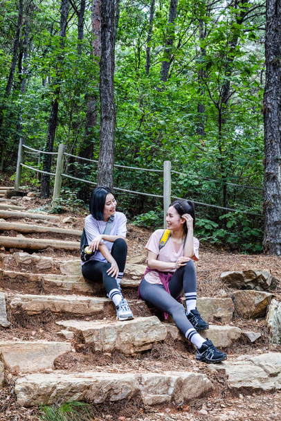 korean young women hiking and plogging_resting - Photo, Image
