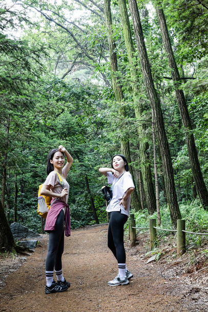 korean young women hiking and plogging_trekking mountain - Photo, Image