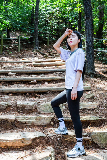 korean young women hiking and plogging_trekking mountain - 写真・画像