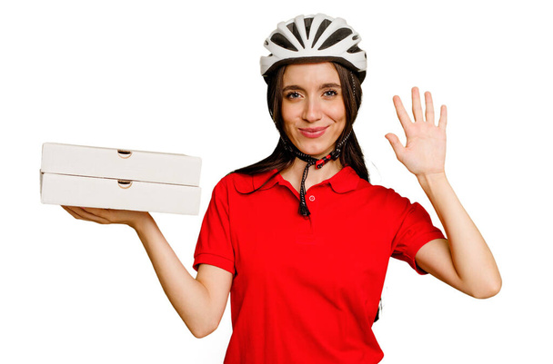 Young caucasian woman holding takeaway pizzas isolated smiling cheerful showing number five with fingers. - Φωτογραφία, εικόνα
