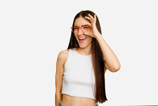 Young caucasian long hair woman isolated excited keeping ok gesture on eye. - 写真・画像