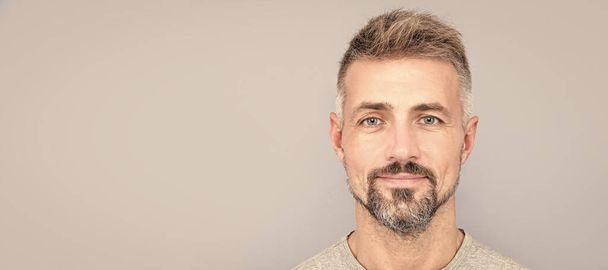 mature handsome man portrait with grizzled beard hair, male beauty. Man face portrait, banner with copy space - Photo, image