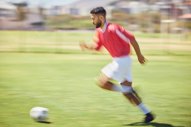Soccer player, running and soccer ball man park training on grass pitch, sports competition or game, goals and winning score. Motion blur professional athlete, football field action or outdoor energy. - Fotografie, Obrázek