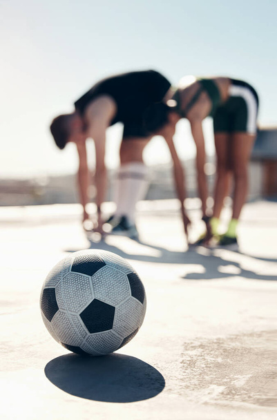 Soccer, stretching and people training in the city for professional event, competition and game. Athlete friends doing a warm up, cardio exercise and workout for football sport together on the ground. - Foto, Imagem