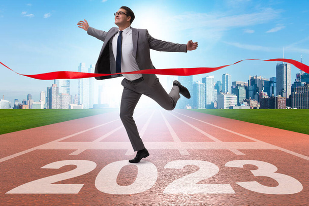 Businessman running to the new 2023 year - Photo, Image