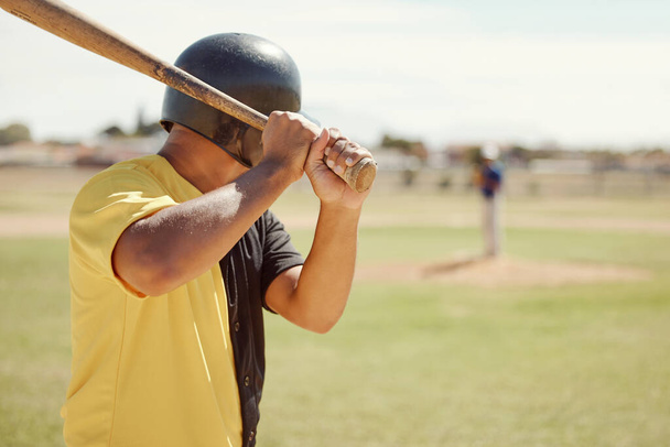 Baseball, athlete and man with a bat on the pitch playing a sport game or fitness training. Sports, softball and man practicing his batting for a match at outdoor field or stadium with a wood baton - Foto, Bild