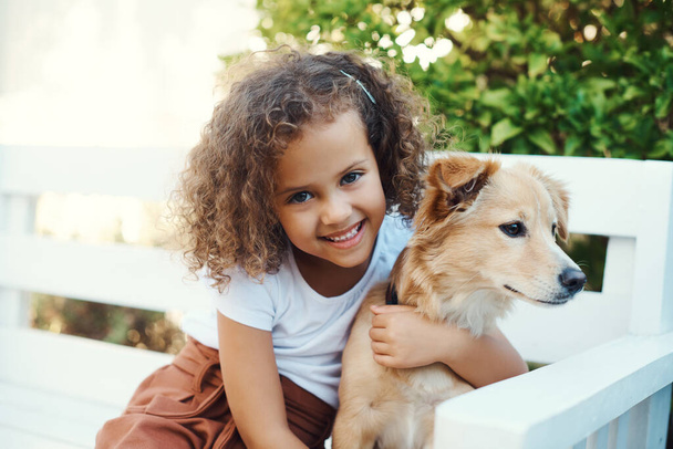 My dog is my best friend. a little girl spending time with her pet dog - Photo, Image