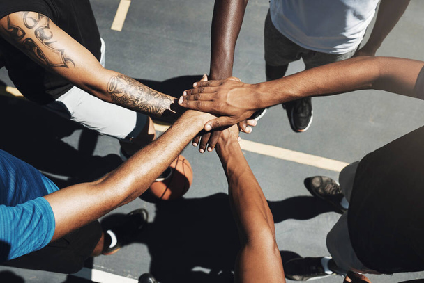 Hands, team and basketball in support, trust and coordination above for unity on the outdoor court. Hand of people in sports teamwork piling together for motivation and collaboration to win game. - Foto, Bild