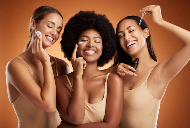 Beauty, skincare and diversity with a model woman group in studio on a brown background for antiaging or wellness. Product, skin and care with female friends posing together for health or cosmetics. - Valokuva, kuva