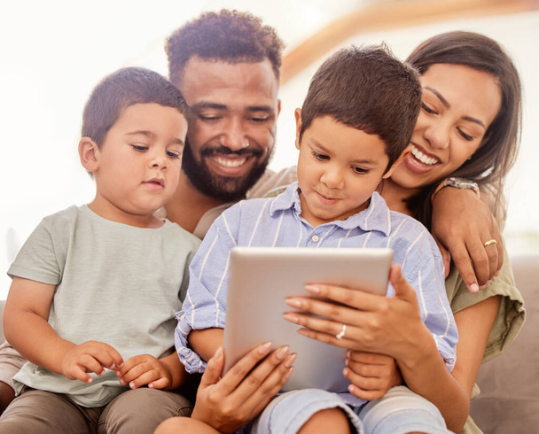 Family bonding, children and tablet kid game of parents and kids together on a education app. Happy people on digital games, internet and online video watching on a house sofa with technology. - Foto, Imagem