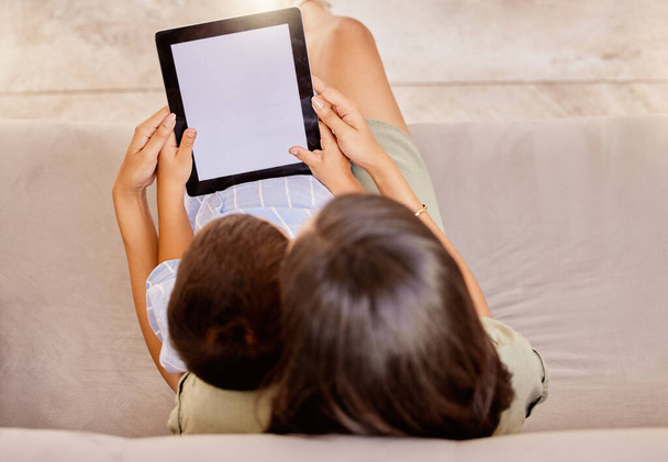 Mother, tablet and child screen, mockup and social media on a sofa from above in home. Marketing, advertising or product placement on technology with woman and boy watching movie subscription online. - Photo, image