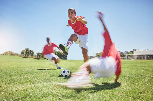 Sports, fitness and soccer, youth on field in summer sun for game, a young man ready to score goal. Football, motivation and running fast, teamwork at training match and practice with soccer ball - Foto, Imagen