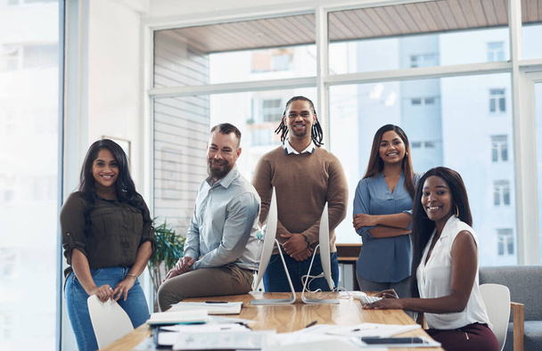 Nothing can stop us from achieving goals. Cropped portrait of a diverse group of businesspeople surrounding a boardroom desk during a meeting in the office - Foto, Imagem