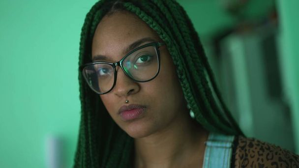 One serious millennial hispanic black girl portrait face looking at camera with box braids hairstyle - Fotografie, Obrázek