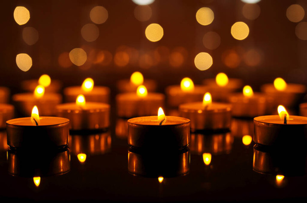 Burning candles in night. Festive Christmas background - Fotoğraf, Görsel