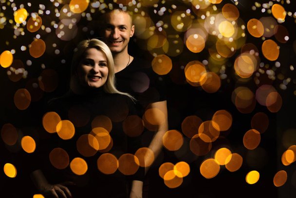 family and garland bokeh background. - Foto, Imagen