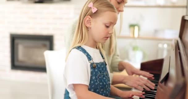 Piano, girl and student learning from teacher teaching musical keyboard skills for child development. Woman, mentor and instructor helping a creative, artistic and young kid be a talented musician. - Imágenes, Vídeo