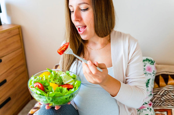 Pregnant healthy food diet. Pregnancy woman eating nutrition diet food salad. Healthy vegetarian food, healthy lifestyle - Photo, Image