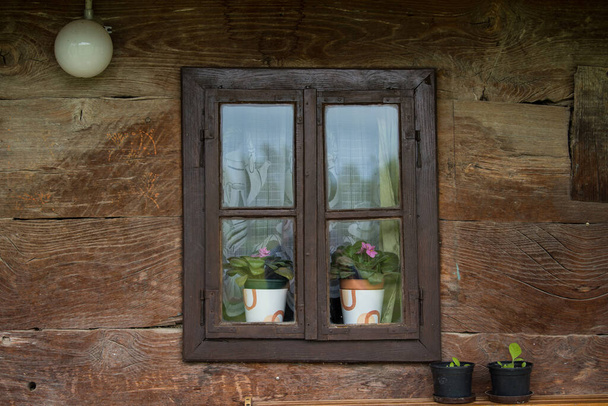 Croatia, October 20,2022 : Rustic style aged window at rural home wall. - Photo, Image