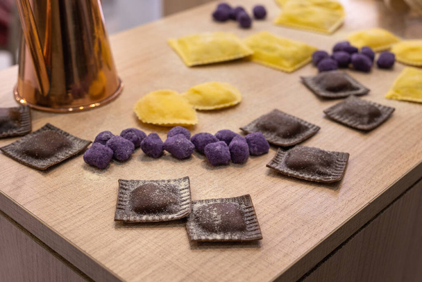 Freshly Made Raw Tortelli and Other Types of Italian Pasta over Wooden Table. - Fotoğraf, Görsel