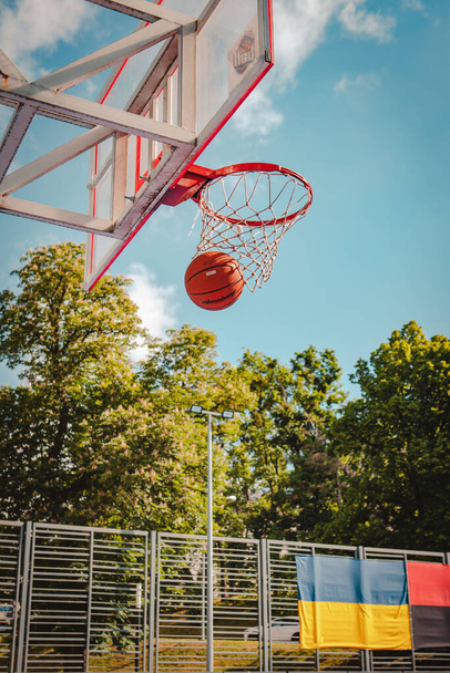 basketball rim with ball in net copy space outdoors - Photo, Image