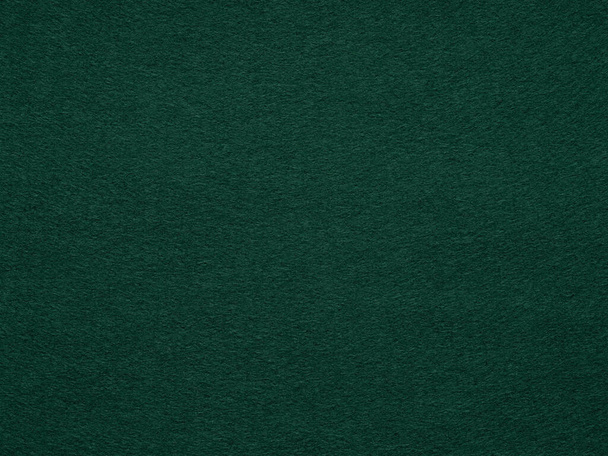 Dark green poker table felt soft rough textile material. Background texture close up with shade vignette. Soft pattern for text, lettering, patchworkor other art work. Full frame backdrop wallpaper. - Photo, Image