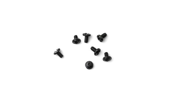 Black computer bolts isolated. Heap of small bolts, screws and nuts on white background top view - Photo, image