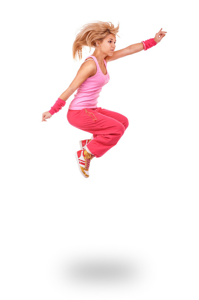 young woman in pink dress jumping - 写真・画像