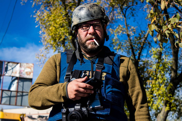 Portrait of Jan Husar, this outstanding journalist and photographer covers the war in Ukraine and in the conflict zones, He covered the war in Iraq, South Sudan, Gaza, the Philippines, Somalia, Sierra Leon, Syria , Kenya, South Africa. In Bakhmut he  - Zdjęcie, obraz
