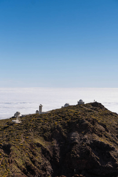 Astrophysics observatory of Roque de los Muchachos in La Palma, Canary Islands. Above the clouds in a sunny day - 写真・画像