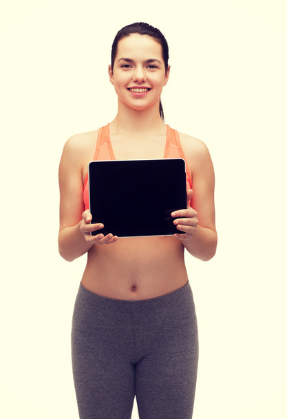 sporty woman with tablet pc blank screen - Фото, изображение