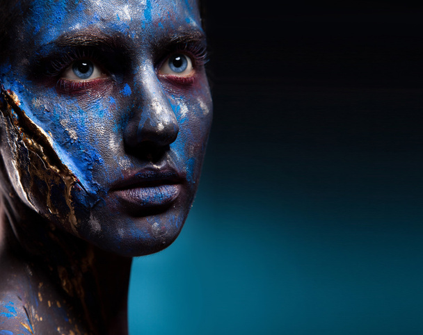 Blue face art woman with scar on face - Photo, Image