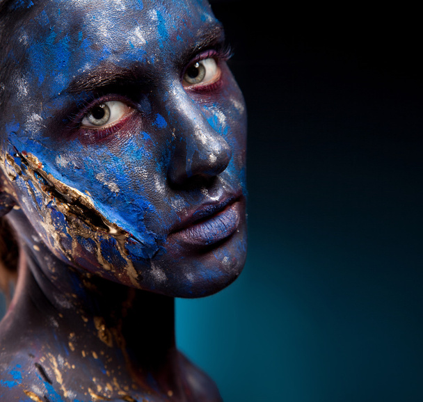 Blue face art woman with scar on face - Fotoğraf, Görsel