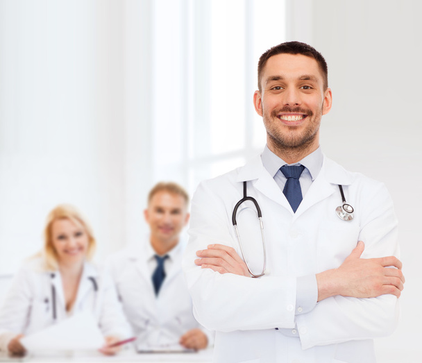 smiling male doctor with stethoscope - Фото, зображення