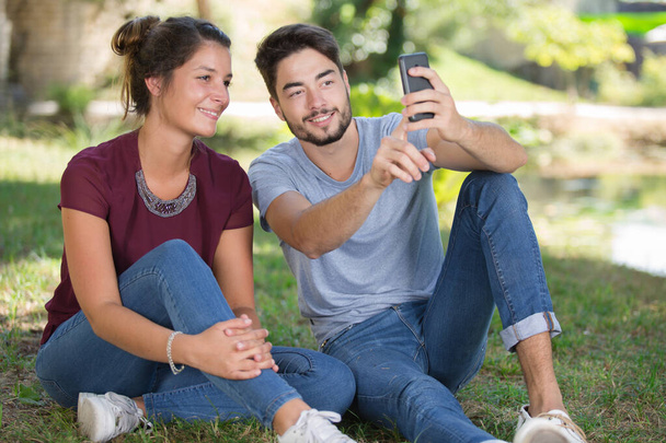 happy couple taking selfie outdoors - Foto, imagen