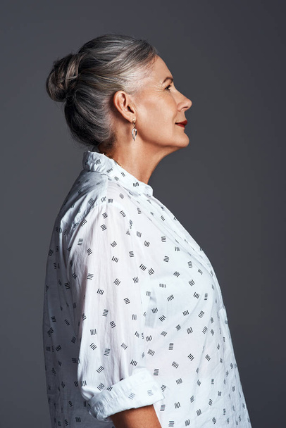 Theres more to me than just my age. Studio shot of a senior woman posing against a grey background - Fotografie, Obrázek