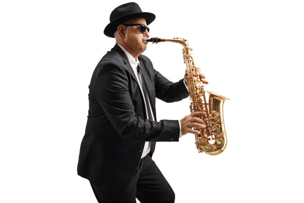 Mature male sax player with sunglasses performing isolated on white background - Foto, afbeelding