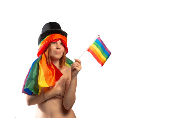 Attractive nude woman wearing rainbow flag hat isolated on white background. LGBT International symbol of the lesbian, gay, bisexual and transgender community. Banner, place for text. - Фото, изображение