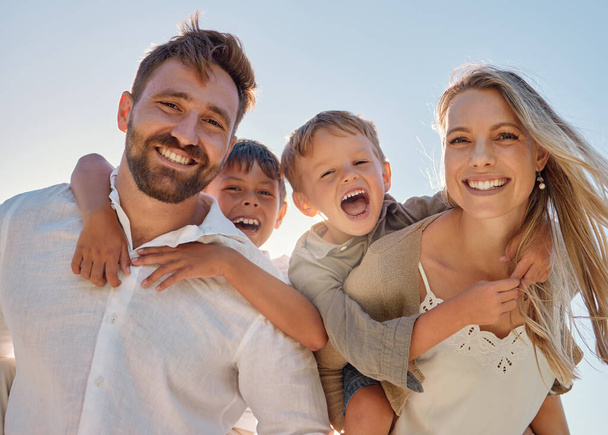 Happy family, portrait and beach with happy, smile and relax mother and father hug, embrace and laughing together. Kids, face and parents on sea vacation with family bonding, excited and cheerful. - Foto, Bild